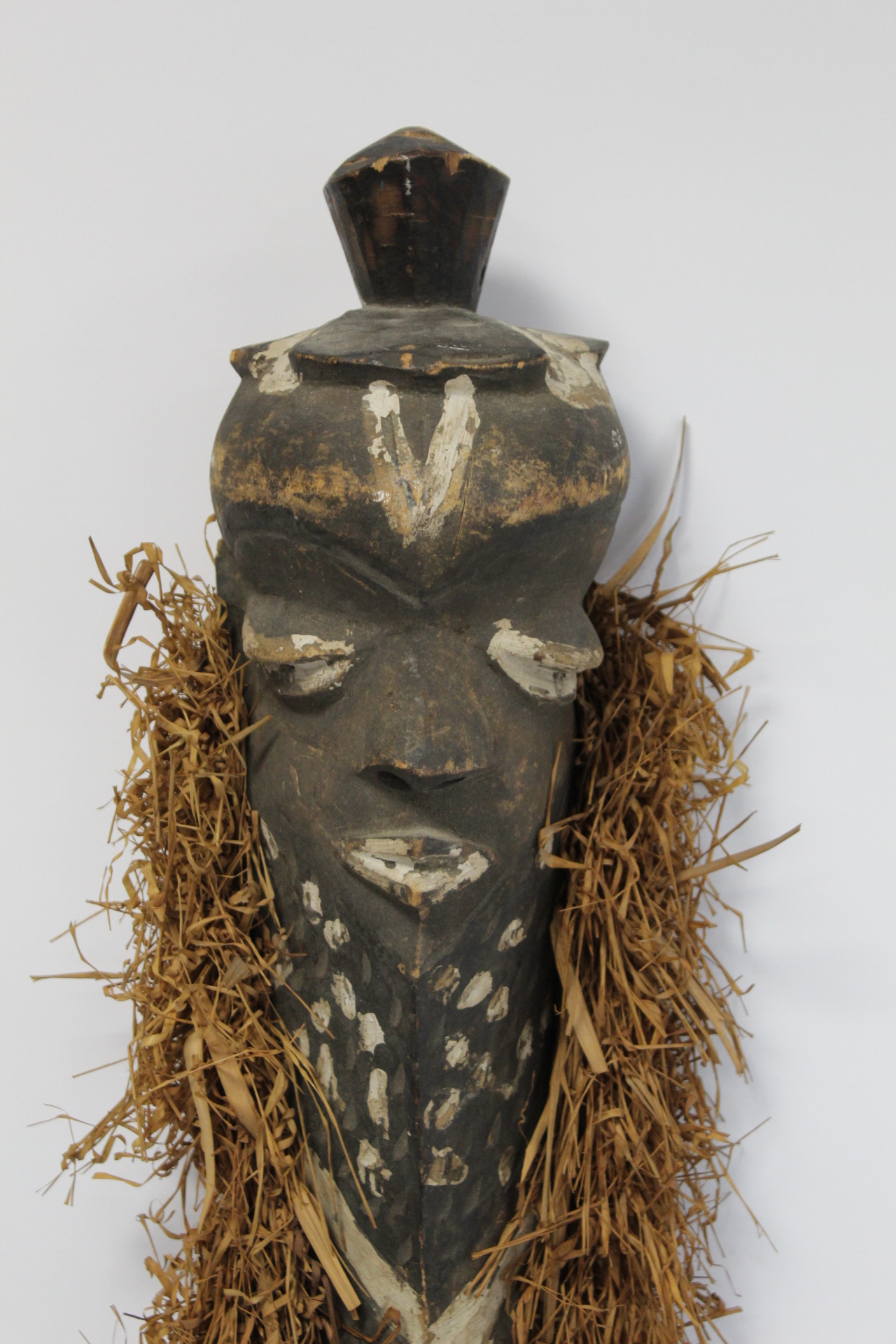 African tribal carved wooden mask of elongated form, with carved and painted facial features, border - Image 2 of 8