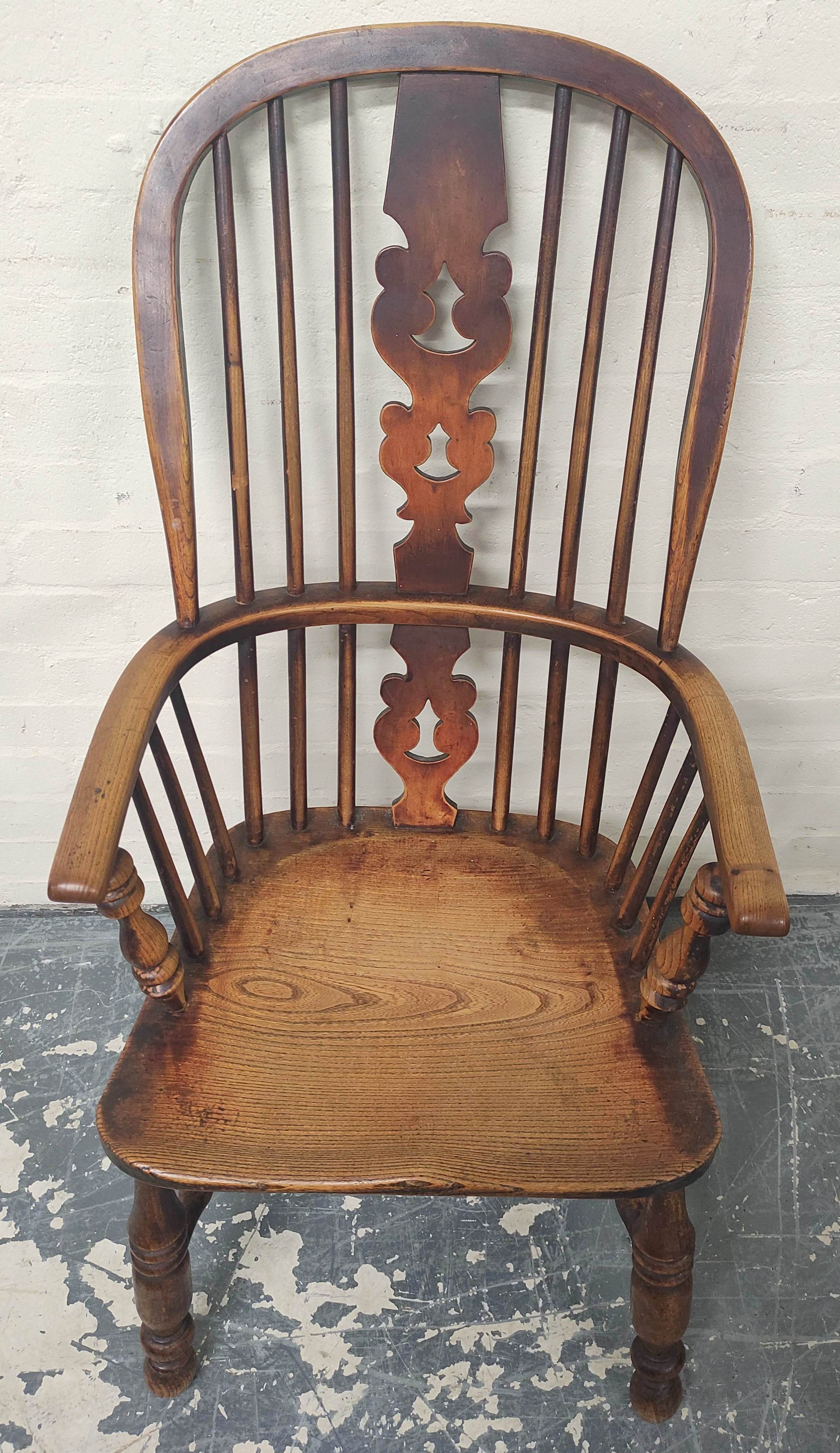 Ash and elm Windsor armchair, the hoop frame with spindle back and pierced splat, raised on turned - Image 3 of 4