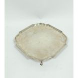 Silver tray of shaped square form with bath border on pad feet, Sheffield 1931, 22cm, 465g / 14½oz.