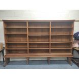 Oak open library bookcase, c.1870's, in the manner of Philip Webb, the moulded pediment above