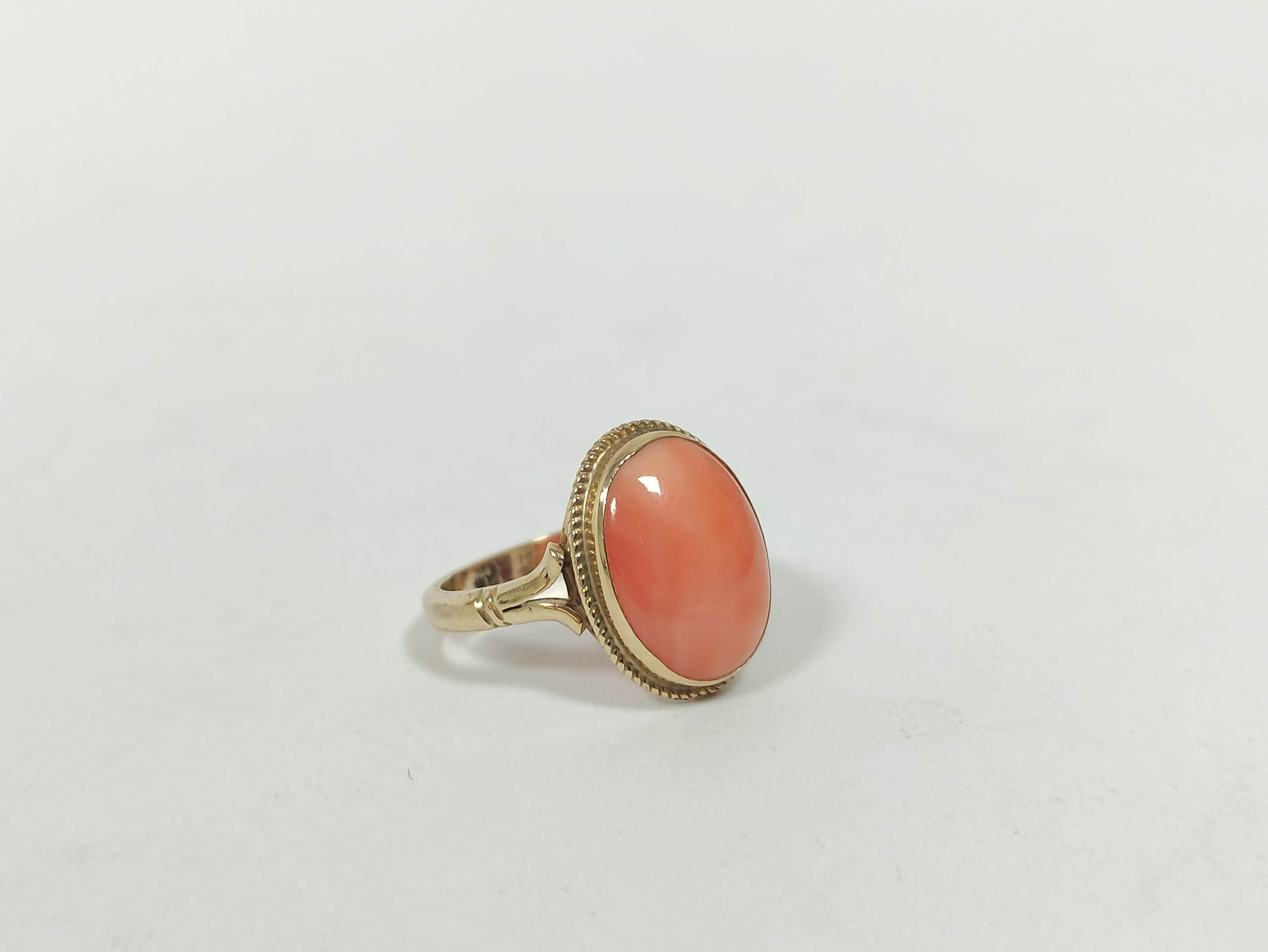 Ring with oval coral cabochon in 9ct gold, size 'L½' and an opal set pin. (2)