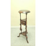 Mahogany wig stand, the saucer top above open recess and two small drawers, on platform base with