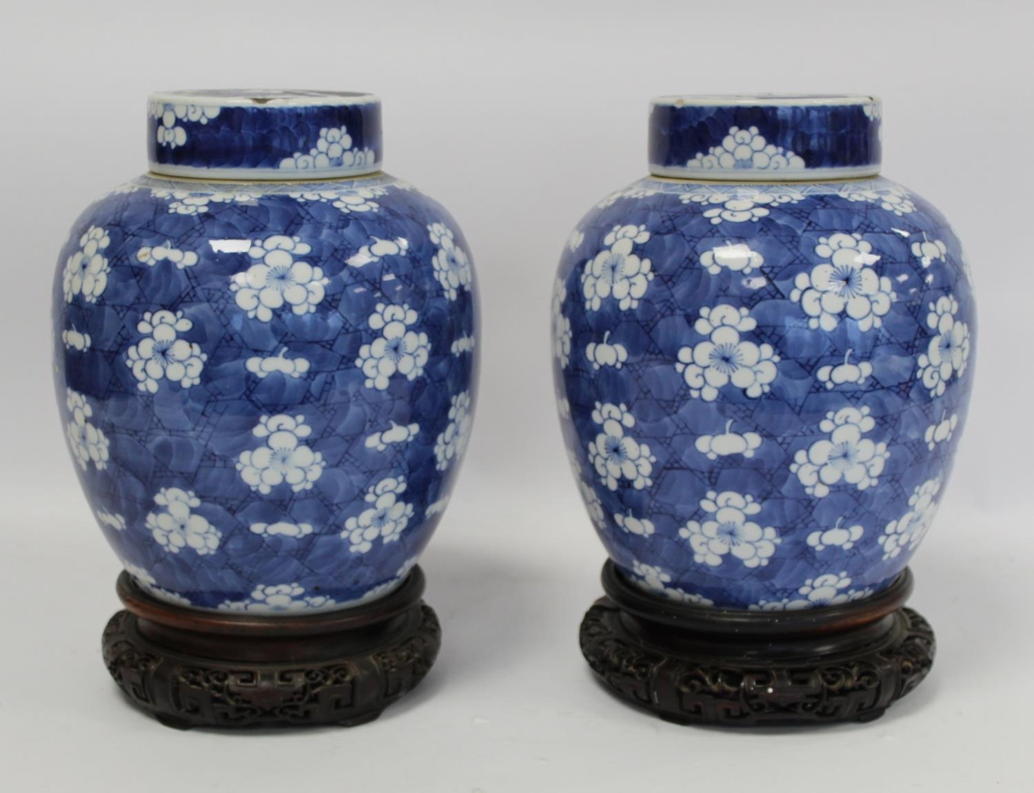 Pair of 19th century Chinese porcelain covered ginger jars of ovoid form with underglaze blue