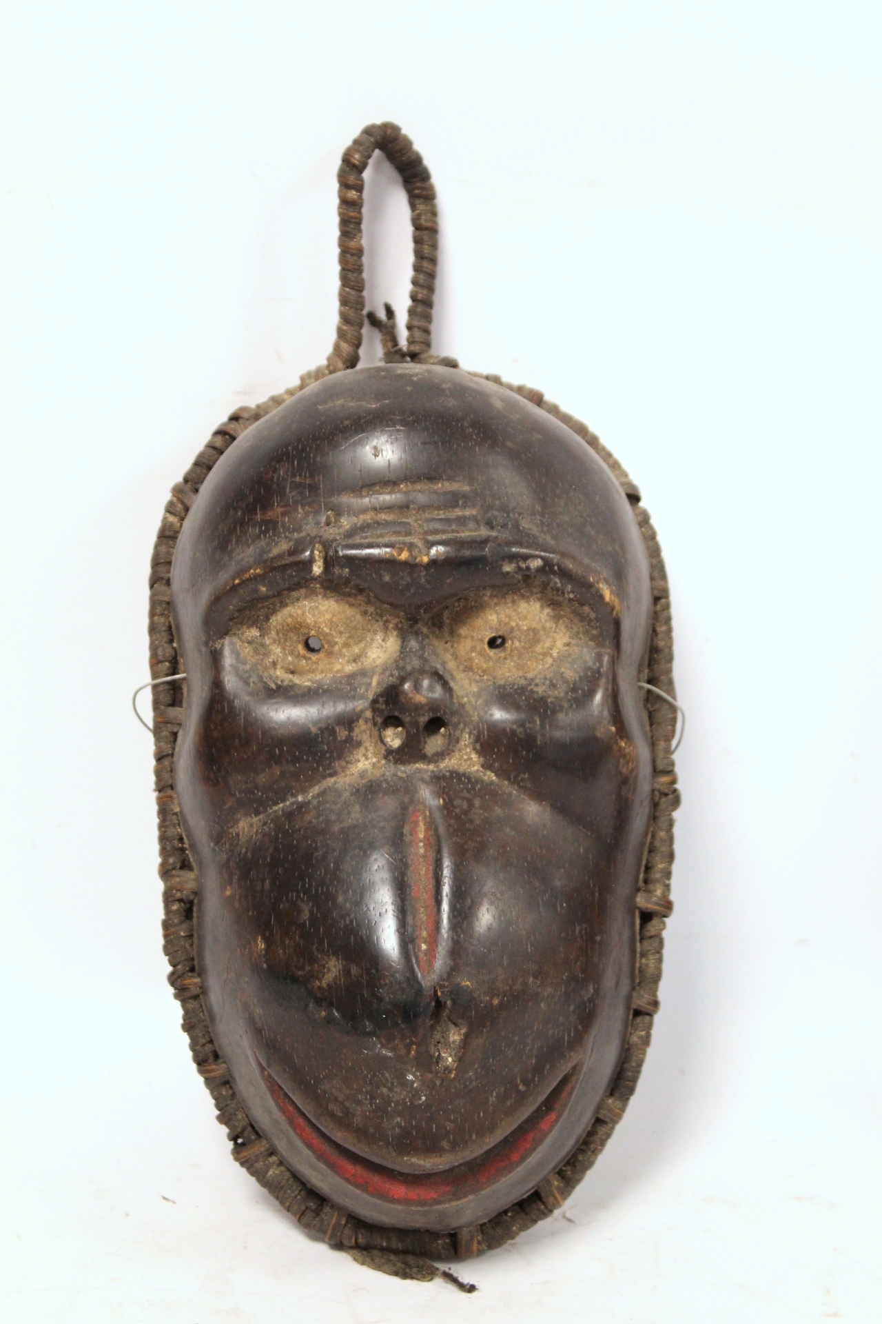 African carved hardwood monkey mask decorated with white and red pigments, with cane binding and - Image 2 of 13