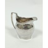 Silver cream jug of ovoid shape with engraved and pin struck bands, by Stephen Adams, 1806, 78g /