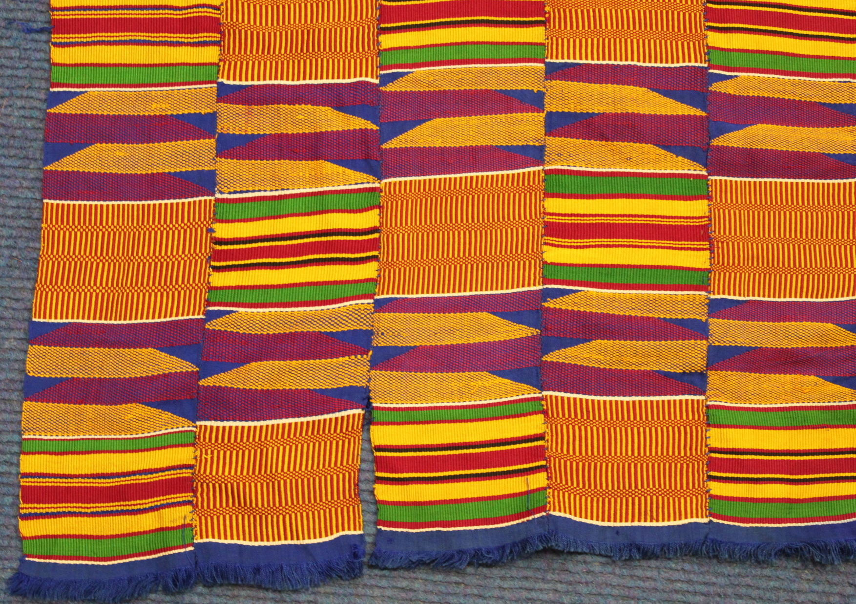 African Asanti Kente cloth in woven silk and cotton fabrics in predominantly blue, yellow, green and - Image 7 of 11