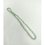 Jadeite bead necklace of graduated green beads, the largest 10mm.