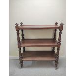 Victorian  mahogany buffet table, with open tiers, on turned columns and reeded finials, on castors,