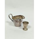 Silver cream jug, Sheffield 1962 and an egg cup, 204g / 6½oz. (2).