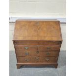 18th century feather banded walnut and pine bureau, the fall front enclosing a fitted interior of