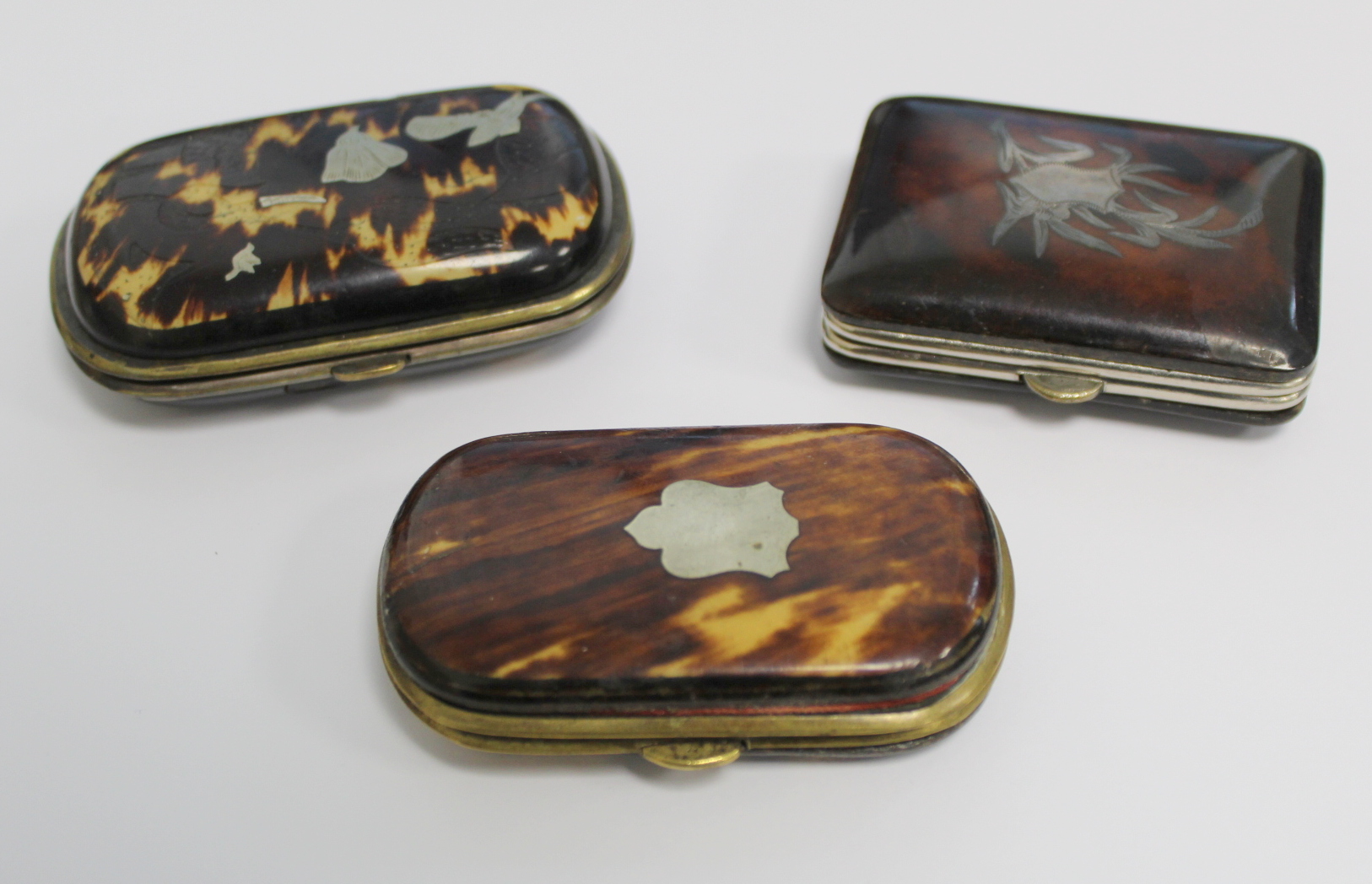 Three 19th century tortoiseshell coin purses with white metal inlay, one inscribed "Present from