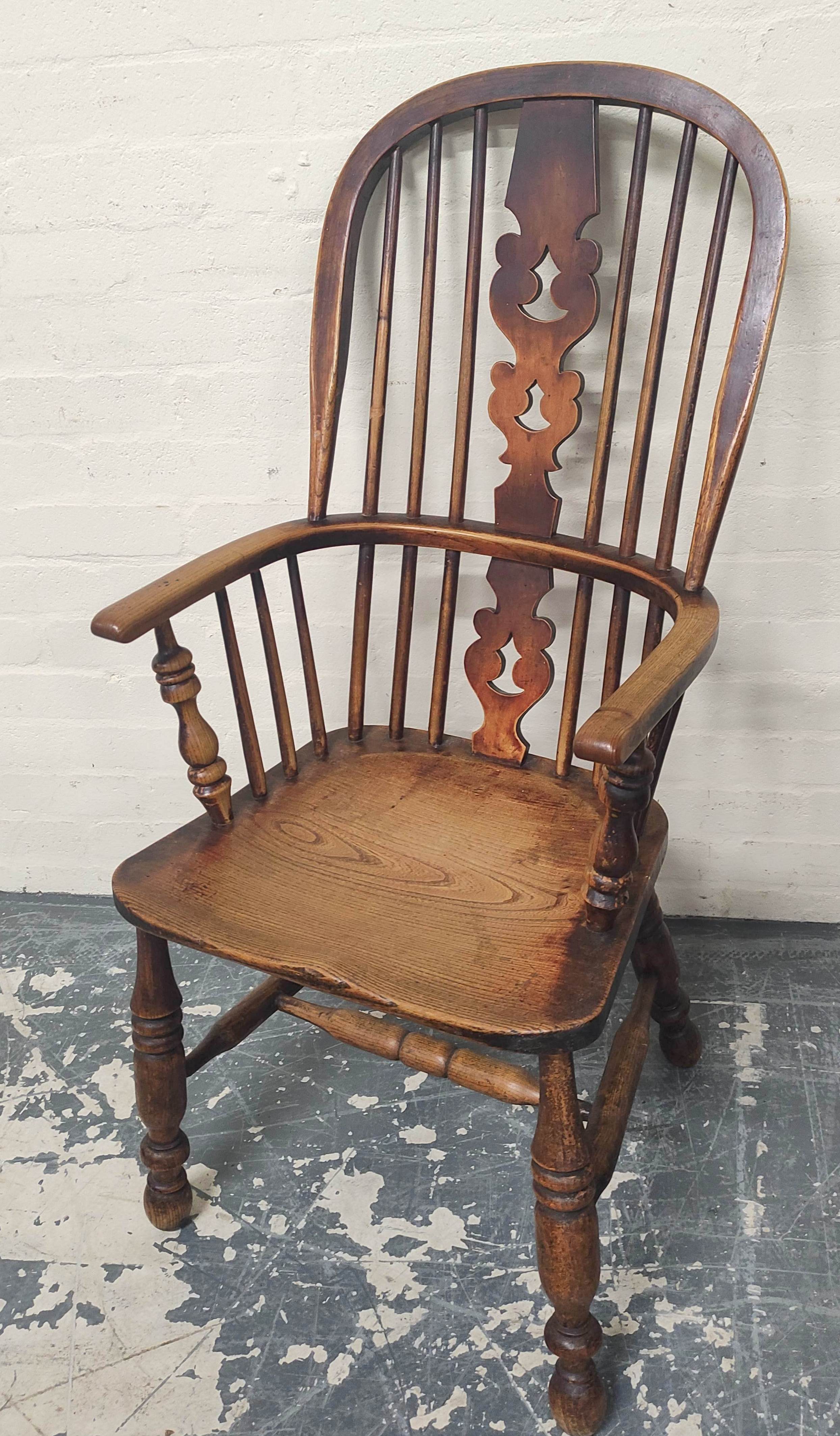 Ash and elm Windsor armchair, the hoop frame with spindle back and pierced splat, raised on turned - Image 2 of 4
