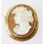 Victorian oval cameo brooch with female portrait in gold engraved mount, probably 15ct, 56mm x 48mm.