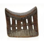 African tribal Ethiopian Kambatta pierced and carved wooden headrest, 19cm wide, 18cm high.