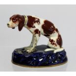 Early to mid-19th century Staffordshire Pottery figure of a seated pointer dog chained to an oval