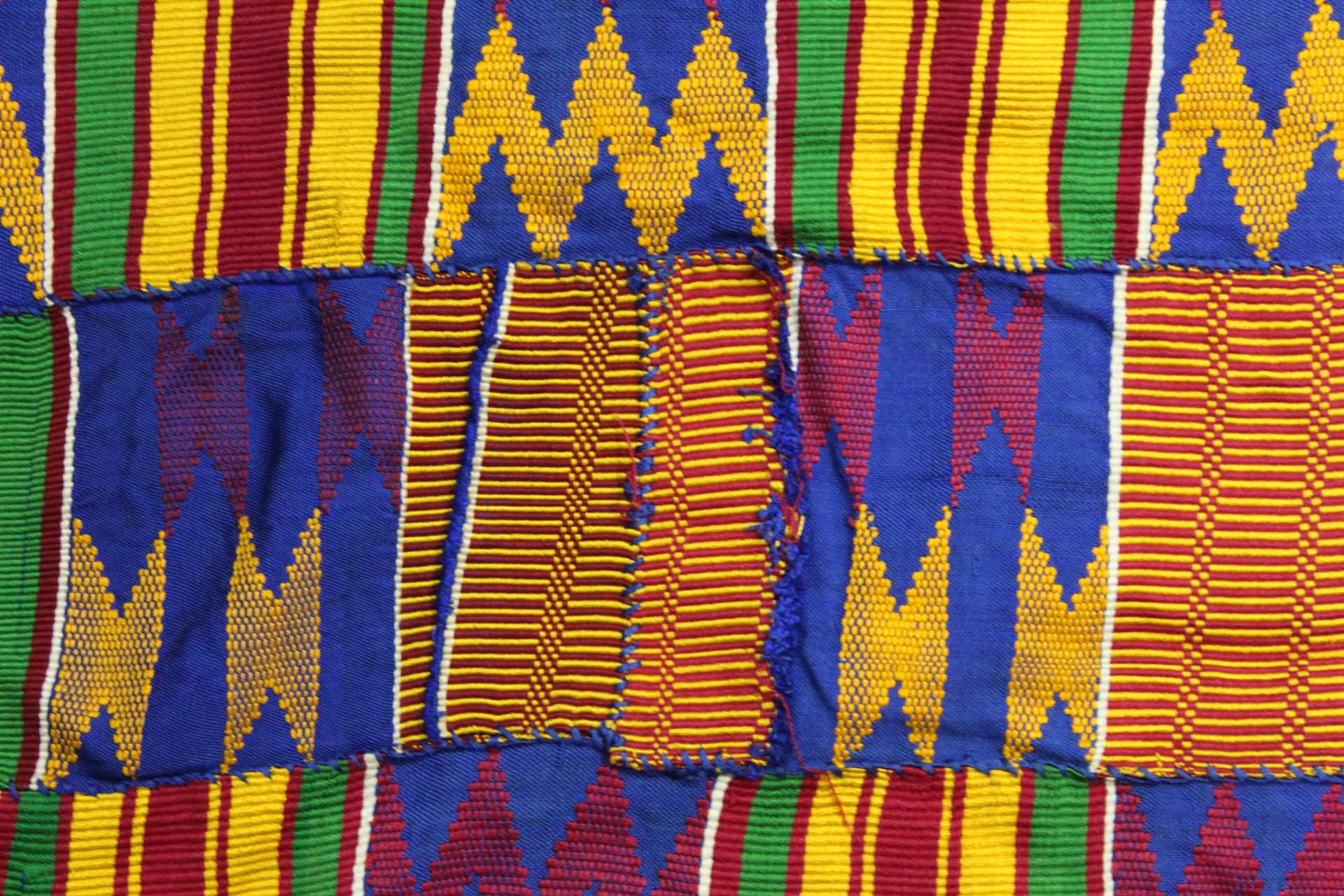 African Asanti Kente cloth in woven silk and cotton fabrics in predominantly blue, yellow, green and - Image 9 of 11