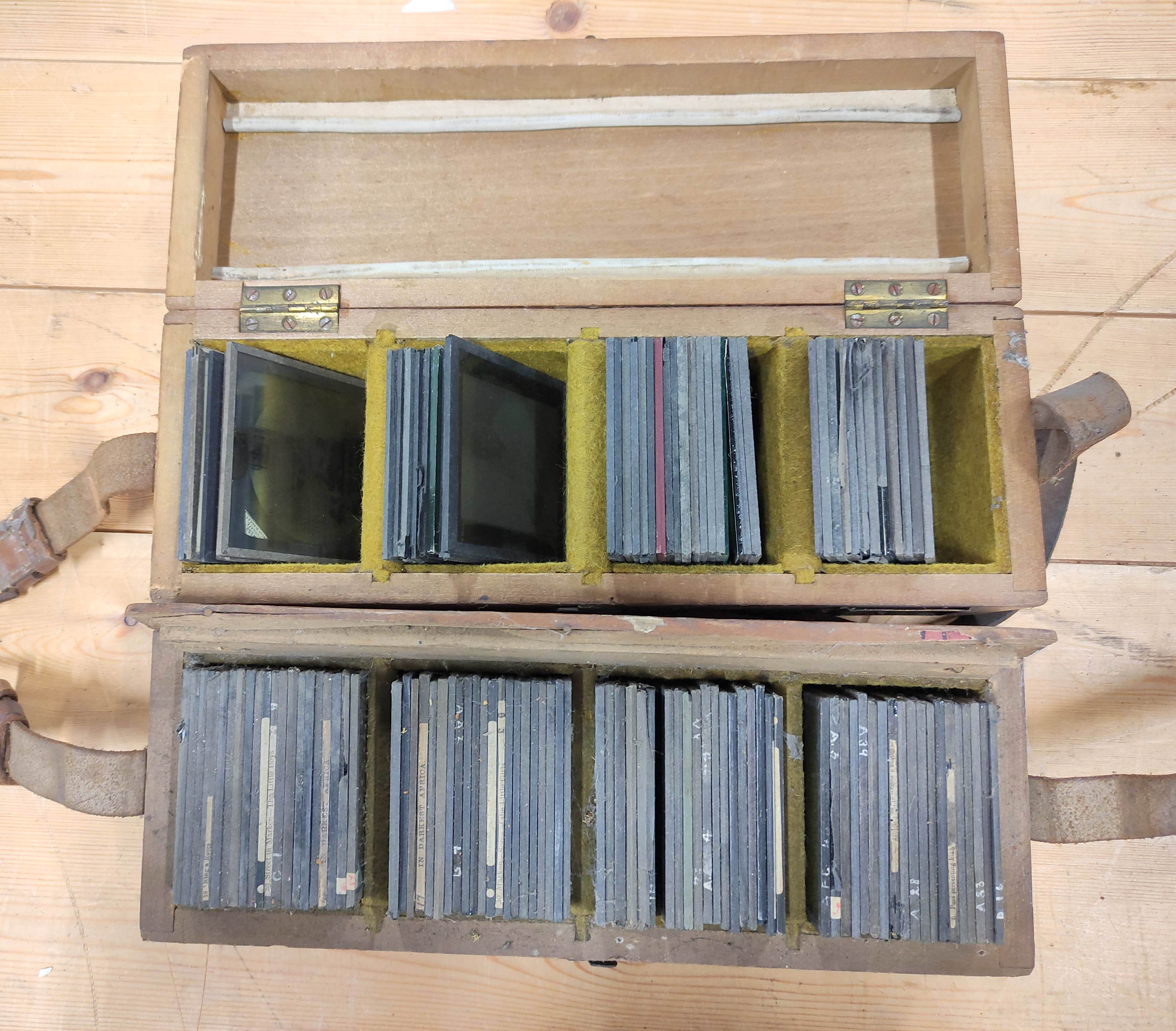 Two boxes of approx 125 mixed monochrome & colour glass slides, many by Newton & Co, comprising of