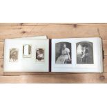 Photographs. Victorian dark morocco oblong album with clasp (defective spine), dec. card leaves,