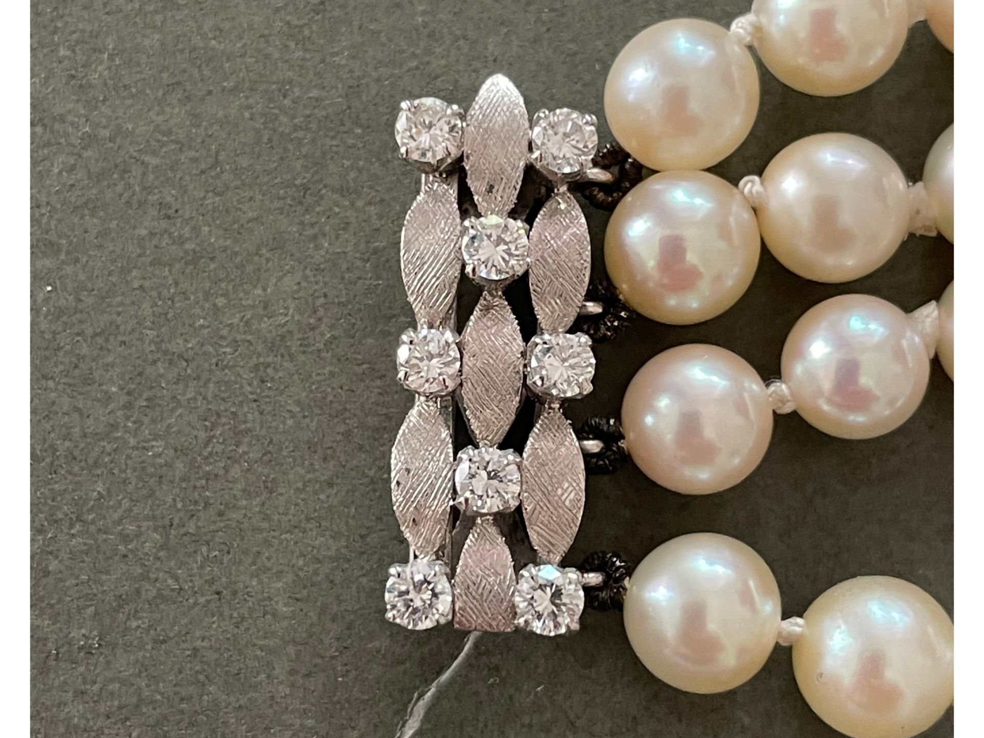 Bracelet of four rows of pearls, 
With white gold mounting and diamonds, 
Ca. 1970 - Image 4 of 4