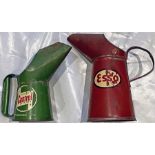 Pair of c1960s metal OIL JUGS comprising a quart-size Esso and a pint-size Castrol. In well-used but