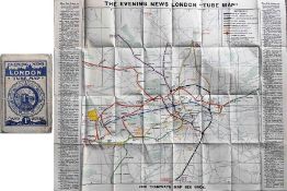 c1910 Evening News London Tube Map. The cover depicts a tube train inside tube segments bearing