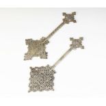 * Two Ethiopian Coptic crosses, 19th century or later, each brass cross of typical reticulated form,