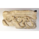 A marble fragmentary relief depicting a spotted hound or panther attacking the back of a man,