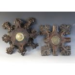 Two late 15th century oak ceiling/roof bosses of barbed quatrefoil form, each with later central