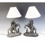 After Guillaume Coustou, a pair of patinated bronze Marly horses, naturalistically modelled