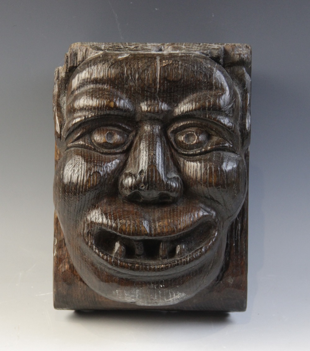 A late 15th century grotesque figural corbel, designed as a male smiling and bearing his teeth, 23. - Image 2 of 8