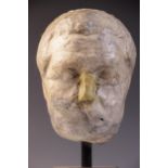 A worn marble male head carved with furrowed brow, with restorations, 24cm high Provenance: Ex Aliso