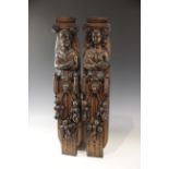 A pair of 17th century carved oak figural terms, Flemish, one male, the other female, both with