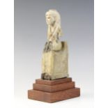 An Egyptian style fragmentary steatite statue of Isis seated on her throne, the figure of the