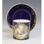 A Sevres porcelain cup and saucer, 18th century, the straight sided cup with bleu lapis ground,