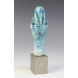 An Egyptian style bright blue glazed faience shabti, 13cm high Provenance: Ex Alison Barker (1951-20