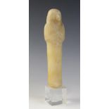 An Egyptian alabaster shabti, some faint traces of the frontal column of hieroglyphic text