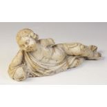 A carved marble fragment depicting a reclining putto with draped material, 22cm long, 10cm high