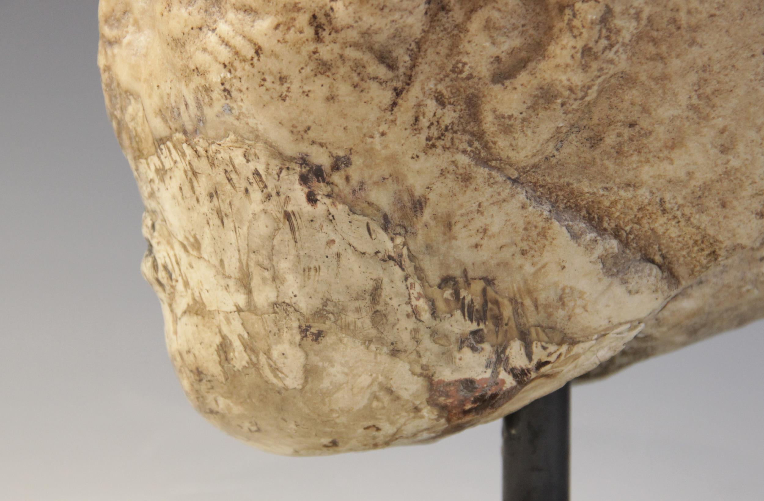 A worn marble male head carved with deeply furrowed brow, with restorations, 26cm high Provenance: - Image 3 of 8