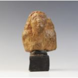 An Egyptian style worn bust, wearing a bag wig, Not Ancient, 10.5cm x 8.5cm Provenance: Ex Alison Ba