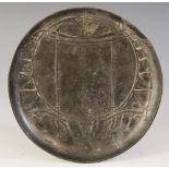 A Liberty Tudric pewter dish designed by Archibald Knox, of circular form, cast in low relief with