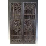 A pair of tracery and christogram type carved panels, circa 1500, elaborately and intricately carved