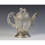 A Chinese carved rock crystal teapot and cover, the bamboo moulded handle adjoined to a body