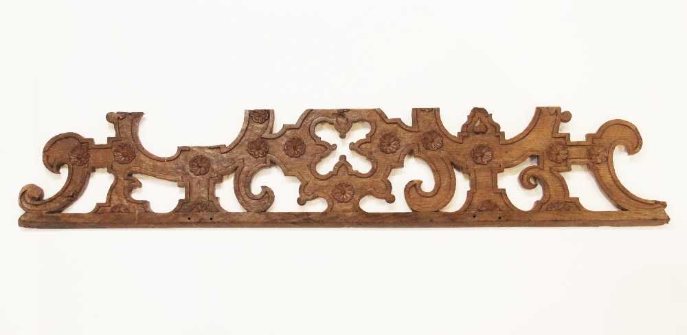 An Elizabeth I, 16th century oak, scroll pierced and flower head carved frieze, circa 1570, 140cm