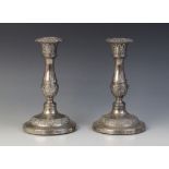 A pair of George IV silver candlesticks, John & Thomas Settle, Sheffield 1823, baluster stems on