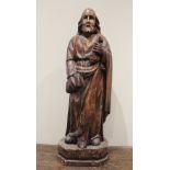 An oak figural carving of St Peter, in the 15th century manner modelled standing, holding keys