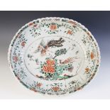 A Chinese porcelain famille verte basin (Kangxi 1661-1722) the oval fluted body decorated