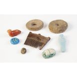 * A small collection of ancient Egyptian and later antiquities, including a wooden hair comb, 52mm