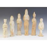 Six Chinese pottery Mingqi burial figures, possibly Han dynasty and later, each modelled in