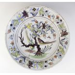 An English Delft charger, 18th century, decorated in the 'Fazackerly' palette, with exotic birds