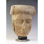 An Egyptian wood sarcophagus mask, traces of the original gesso painted decoration remain on the